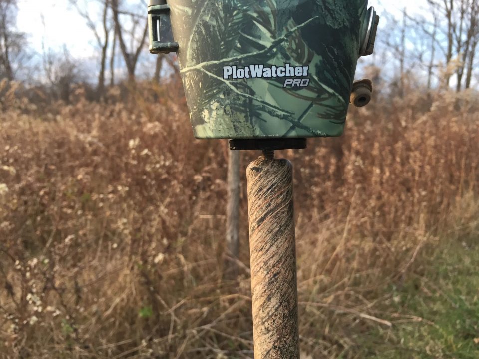 A PlotWatcher Pro mounted on the threaded end of an old shooting stick.